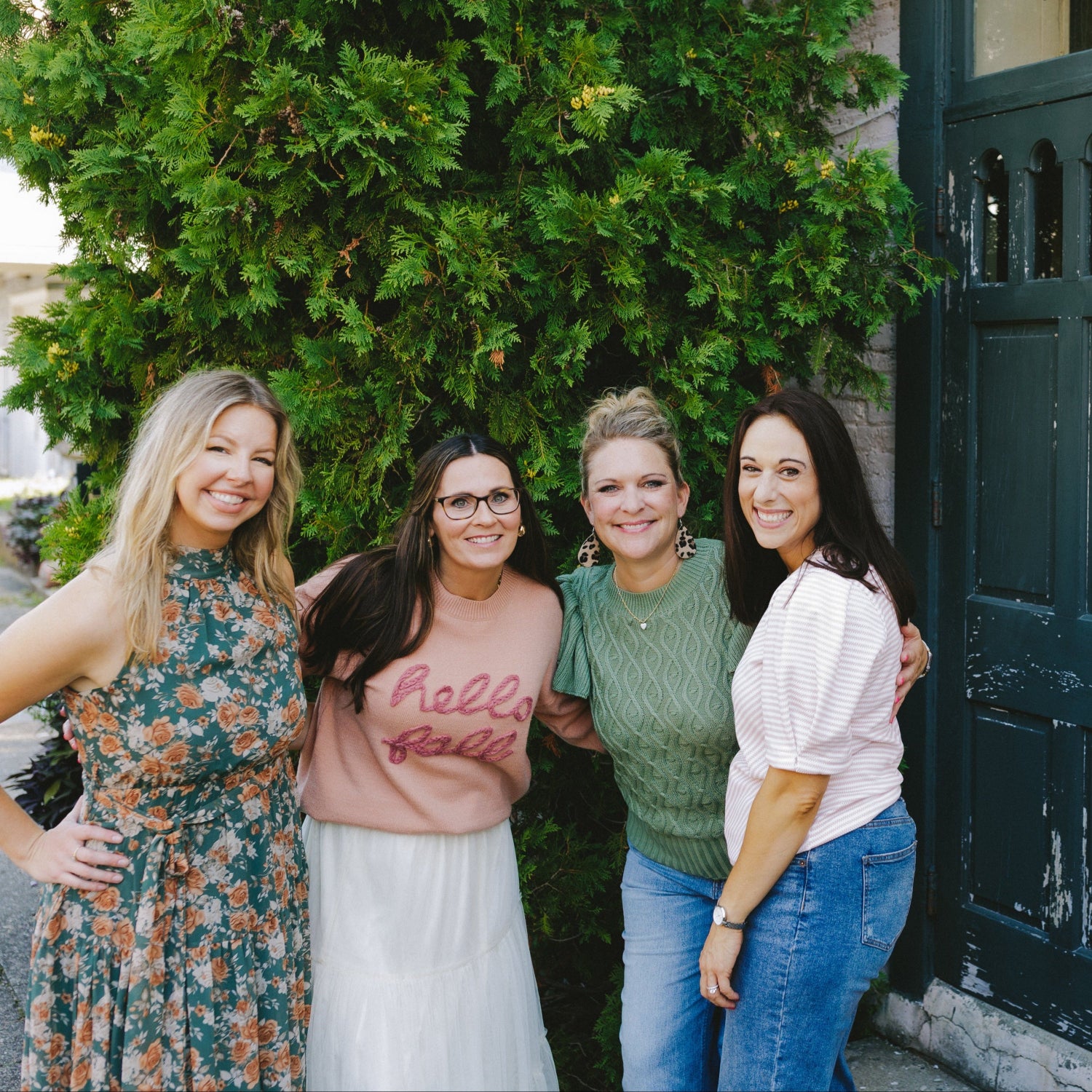 Women in trendy fall outfits: floral dress, hello fall sweater, green knit top, and puff sleeve top with jeans