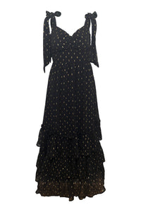 Black polka dot dress with bow straps on a white background