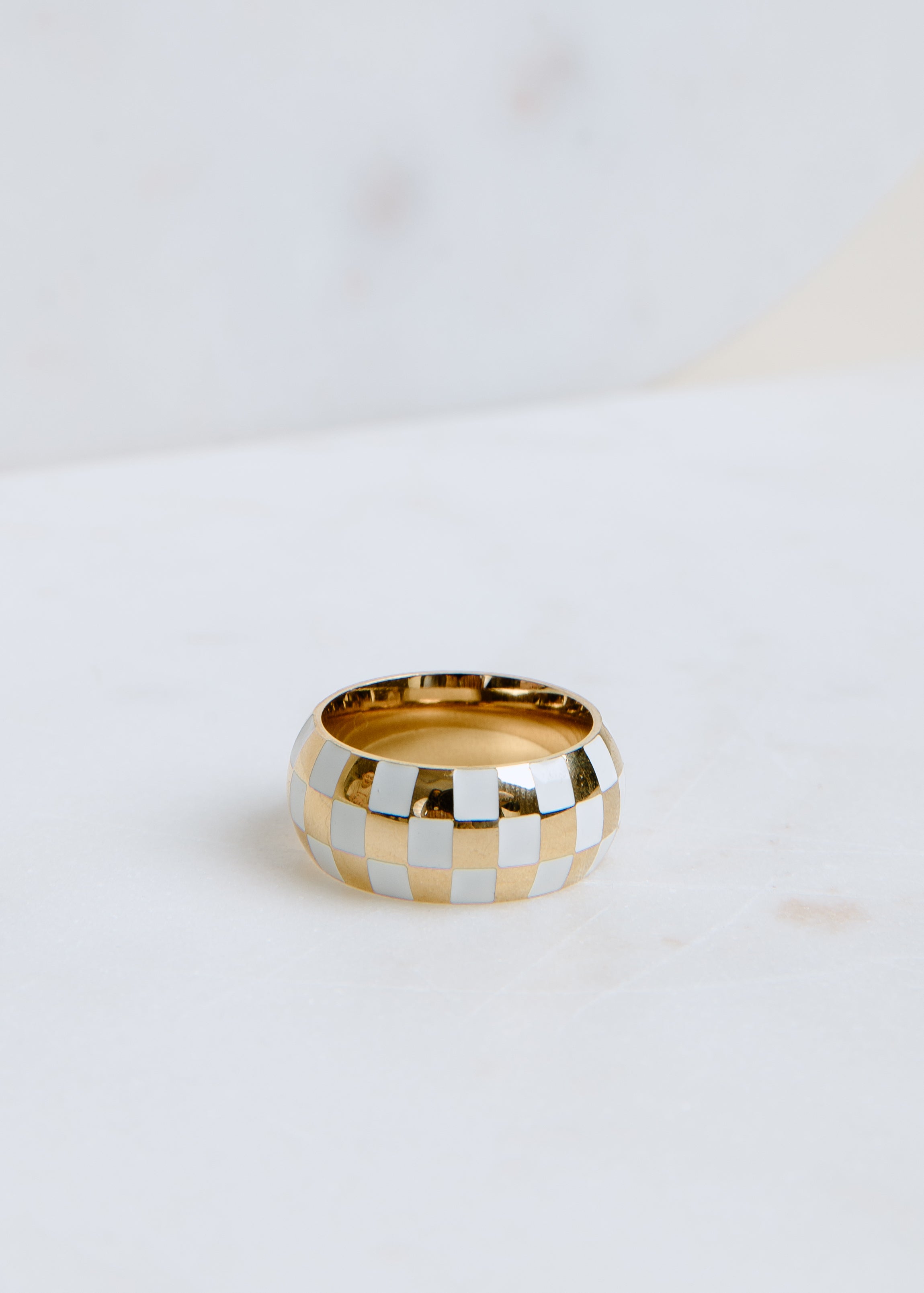 statement gold checkerboard ring with glossy enamel finish