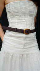 soft suede belt in rich brown tone featuring organic gold buckle on model